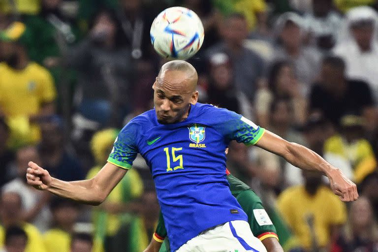 Brazil's midfielder #15 Fabinho heads the ball during the Qatar 2022 World Cup Group G football match between Cameroon and Brazil at the Lusail Stadium in Lusail, north of Doha on December 2, 2022. (Photo by Jewel SAMAD / AFP)