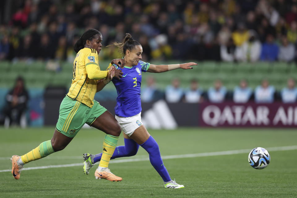 Jamaica's Khadija Shaw, left, in action against Brazil's Kathleen during the Women's World Cup Group F soccer match between Jamaica and Brazil in Melbourne, Australia, Wednesday, Aug. 2, 2023. (AP Photo/Victoria Adkins)