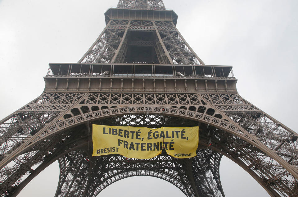 <p>Greenpeace activists display a banner at the Eiffel tower reads,”liberty, equality, fraternity” in Paris, France, Friday, May 5, 2017. The protest is against far-right presidential candidate Marine Le Pen two days before the runoff. (AP Photo/Michel Euler) </p>