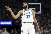 Minnesota Timberwolves center Karl-Anthony Towns (32) celebrates his 3-point basket against the Phoenix Suns during the first half of an NBA basketball game, Sunday, April 14, 2024, in Minneapolis. (AP Photo/Matt Krohn)