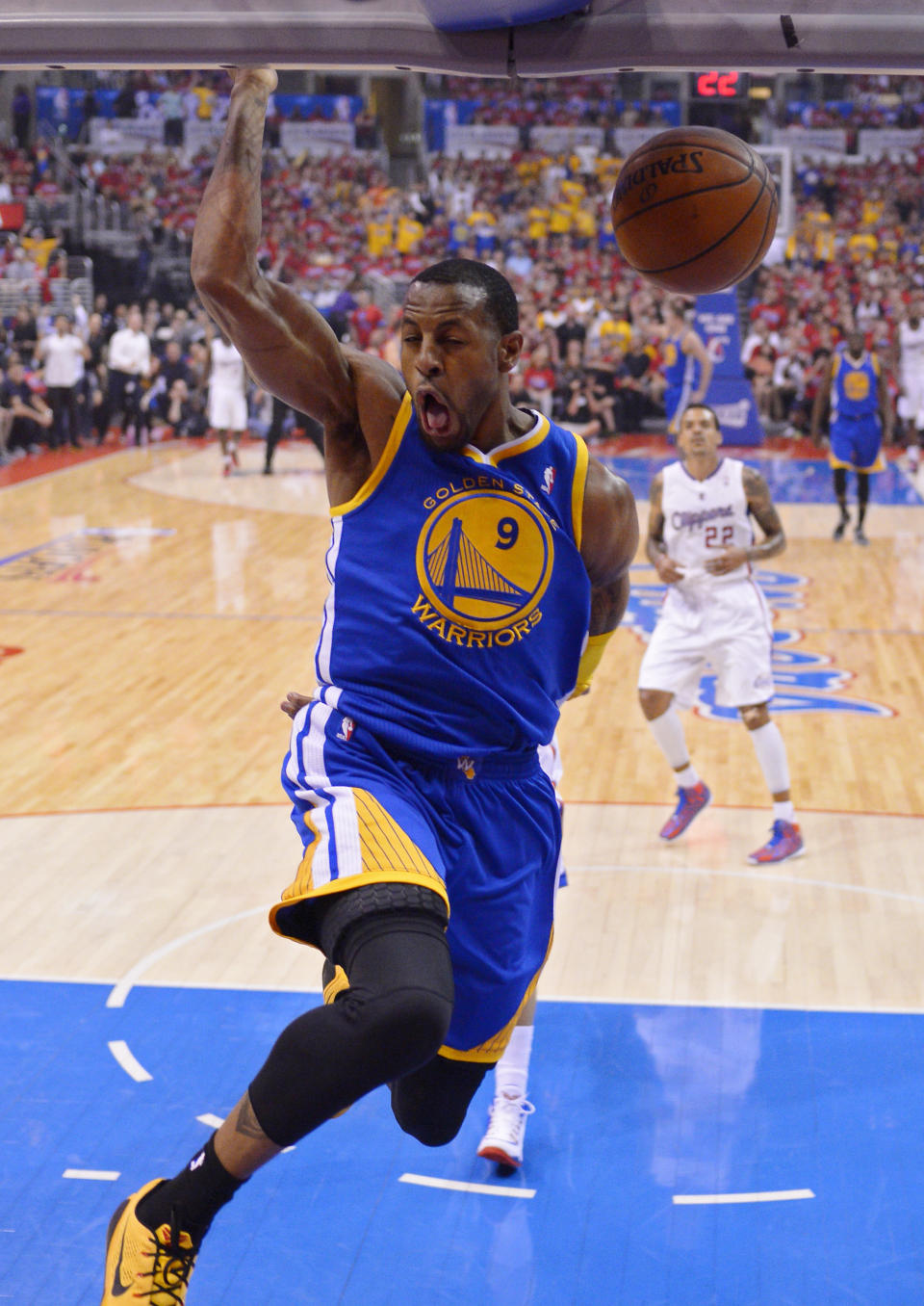 Golden State Warriors forward Andre Iguodala (9) dunks as Los Angeles Clippers forward Matt Barnes looks on during the first half in Game 7 of an opening-round NBA basketball playoff series, Saturday, May 3, 2014, in Los Angeles. (AP Photo/Mark J. Terrill)