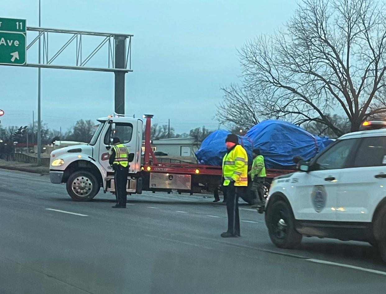 Crews work to clear the scene of a fatal crash on Interstate Highway 235 in Des Moines on Thursday, Jan. 12, 2023.