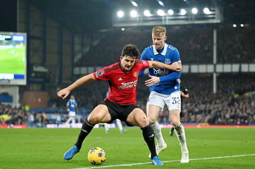 Harry Maguire of Manchester United on the ball whilst under pressure from Jarrad Branthwaite of Everton