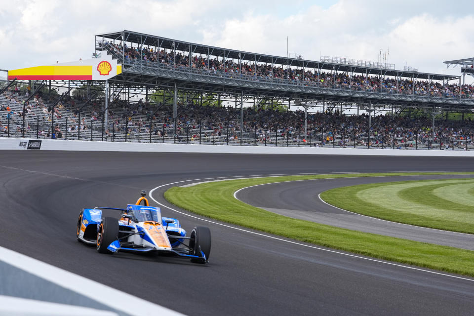 Kyle Larson drives through the first turn during qualifications for the Indianapolis 500 auto race at Indianapolis Motor Speedway in Indianapolis, Saturday, May 18, 2024. (AP Photo/Michael Conroy)