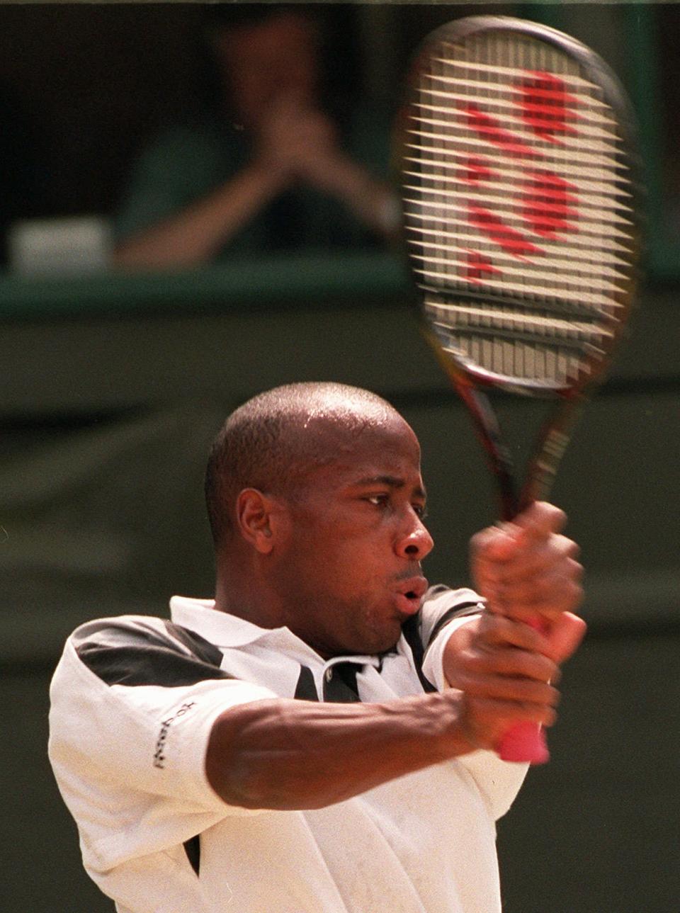 FILE - MaliVai Washington, of the United States, returns to Richard Krajicek, of the Netherlands, during the men's singles tennis final at Wimbledon on July 7, 1996. Frances Tiafoe is the first man from the United States to reach the semifinals at Flushing Meadows in 16 years. And he could become the first Black man from the U.S. in a major final since MaliVai Washington was the runner-up at Wimbledon in more than a quarter-century ago. (AP Photo/Dave Caulkin, File)