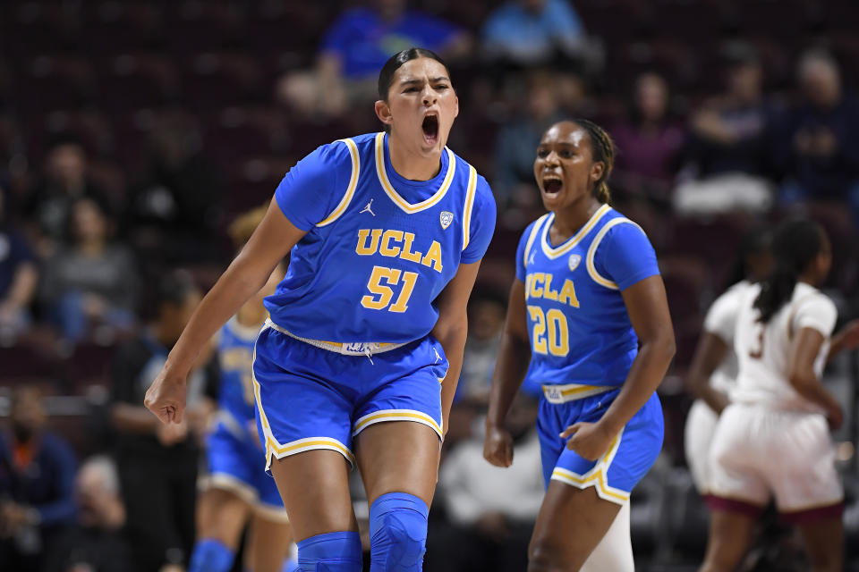 UCLA center Lauren Betts (51) and UCLA guard Charisma Osborne (20) react in the first half of an NCAA college basketball game against Florida State, Sunday, Dec. 10, 2023, in Uncasville, Conn. (AP Photo/Jessica Hill)