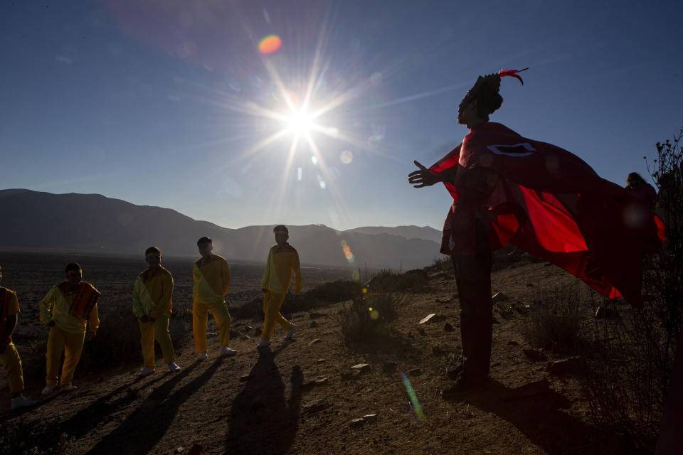 A youth dressed as a shaman arrives to take part in a photo session before Tuesday's total solar eclipse, in La Higuera, Chile, July 1, 2019. (Photo: Esteban Felix/AP)