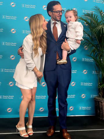 <p>Mike Stocker/South Florida Sun Sentinel/Tribune News Service/Getty</p> Mike McDaniel with his wife, Katie Hemstalk, and their daughter, Ayla