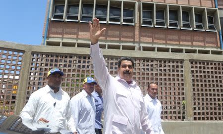 Venezuela's President Nicolas Maduro (C) greets supporters as he arrives to an inauguration of a new school in La Guaira, Venezuela September 26, 2016. Miraflores Palace/Handout via REUTERS