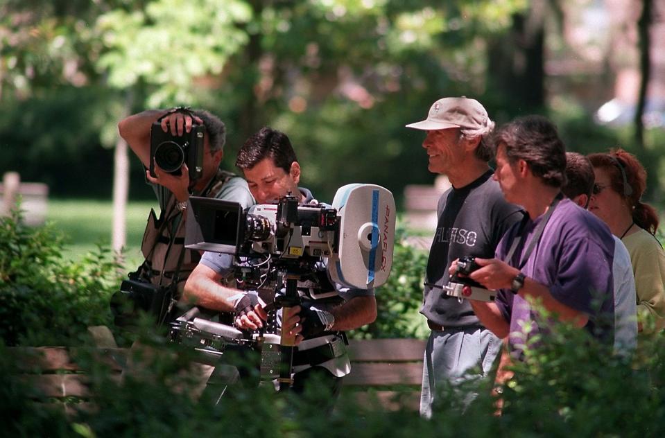 Director Clint Eastwood (third from left) on the set of 'Midnight in the Garden of Good and Evil' on location in historic Savannah, Ga.