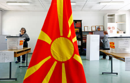 People cast their ballot for the presidential elections in Skopje, North Macedonia April 21, 2019. REUTERS/Ognen Teofilovski