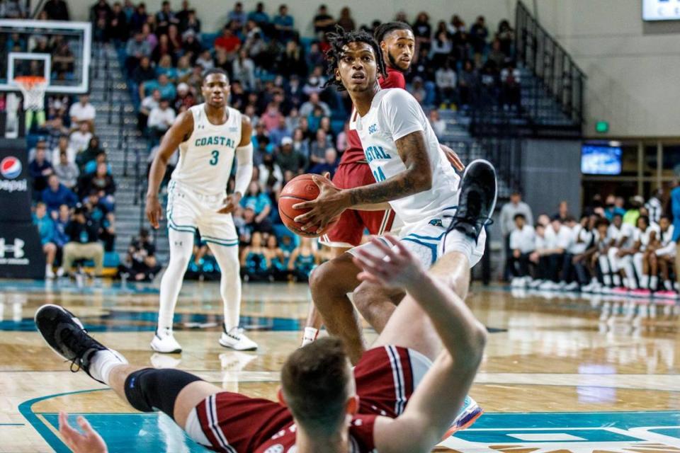 Coastal Carolina’s Vince Cole is called for a charge Wednesday against South Carolina. The Chanticleers of the Sun Belt Conference hosted the Gamecocks of the SEC in college basketball at the HTC Center in Conway, SC for the first time. Dec. 1, 2021.