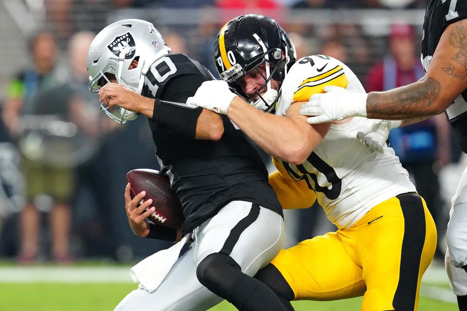 Pittsburgh Steelers linebacker T.J. Watt sacks Las Vegas Raiders quarterback Jimmy Garoppolo.