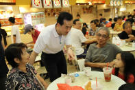 People's Action Party candidate Koh Poh Koon speaks to residents at Rivervale Mall during a walkabout on Sunday, 13 January. (Yahoo! photo)