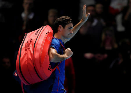 FILE PHOTO: Tennis - ATP Finals - The O2, London, Britain - November 11, 2018 Switzerland's Roger Federer looks dejected as he walks off court after losing his group stage match against Japan's Kei Nishikori Action Images via Reuters/Tony O'Brien/File Photo