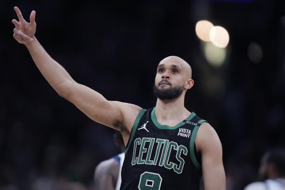 Boston Celtics guard Derrick White celebrates after hitting a 3-pointer against the Dallas Mavericks during the second half of Game 2 of the NBA Finals basketball series, Sunday, June 9, 2024, in Boston. (AP Photo/Steven Senne)