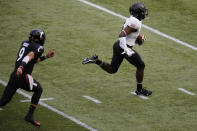 Army defensive back Jabari Moore, right, outruns Cincinnati quarterback Desmond Ridder to the end zone after intercepting Ridder's pitch during the first half of an NCAA college football game Saturday, Sept. 26, 2020, in Cincinnati, Ohio. Moore scored a touchdown on the play. (AP Photo/Jay LaPrete)