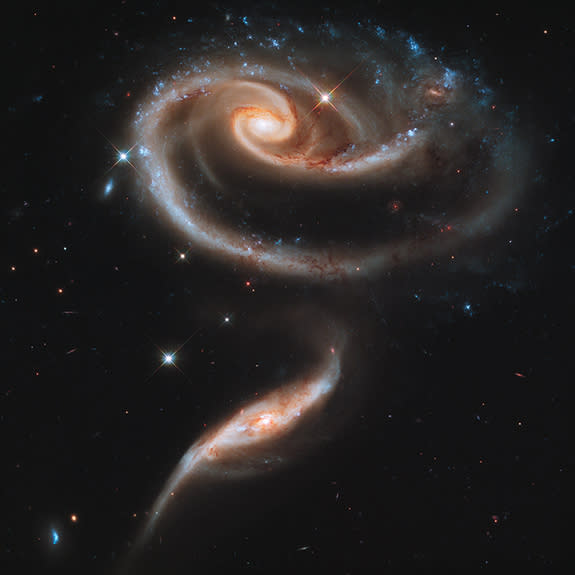 Two interacting galaxies (UGC 1810 on top and UGC 1813 below) that are together known as Arp 273, were captured by the Hubble Space Telescope.