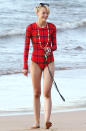 <p>Jaime King's long-sleeve, plaid Cover swimsuit brings the joy of fall bundling to the beach. All she's missing is the Pumpkin Spice Latte.</p>