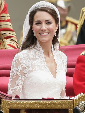 <p>Indigo/Getty</p> Catherine, Duchess of Cambridge travels down The Mall on route to Buckingham Palace in a horse drawn carriage following her wedding at Westminster Abbey on April 29, 2011 in London, England.