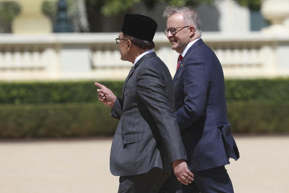 The Prime Minister of Malaysia Anwar Ibrahim, left, walks with Australian Prime Minister Anthony Albanese following a ceremonial welcome ceremony at Government House ahead of the ASEAN-Australia Special Summit in Melbourne, Australia, Monday, March 4, 2024.An increasingly assertive China and a humanitarian crisis in Myanmar are likely to be high on the agenda when Southeast Asian leaders meet in Australia for a rare summit March 4-6. (AP Photo/Hamish Blair)