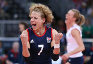 LONDON, ENGLAND - JULY 30: Maria Bertelli of Great Britain celebrates winning a point in the Women's Volleyball Preliminary match between Great Britain and Algeria on Day 3 of the London 2012 Olympic Games at Earls Court on July 30, 2012 in London, England. (Photo by Elsa/Getty Images)