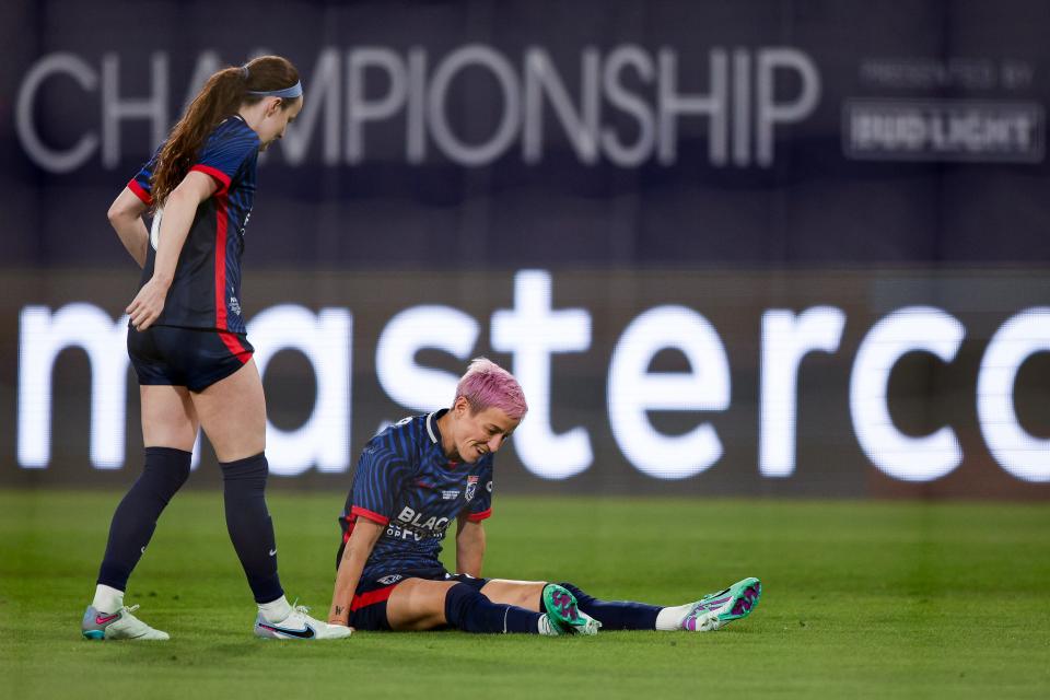 SAN DIEGO, CALIFORNIA - NOVEMBER 11: Megan Rapinoe #15 of OL Reign is injured in the first half against the NJ/NY Gotham FC during the 2023 NWSL Championship game at Snapdragon Stadium on November 11, 2023 in San Diego, California. (Photo by Meg Oliphant/Getty Images)