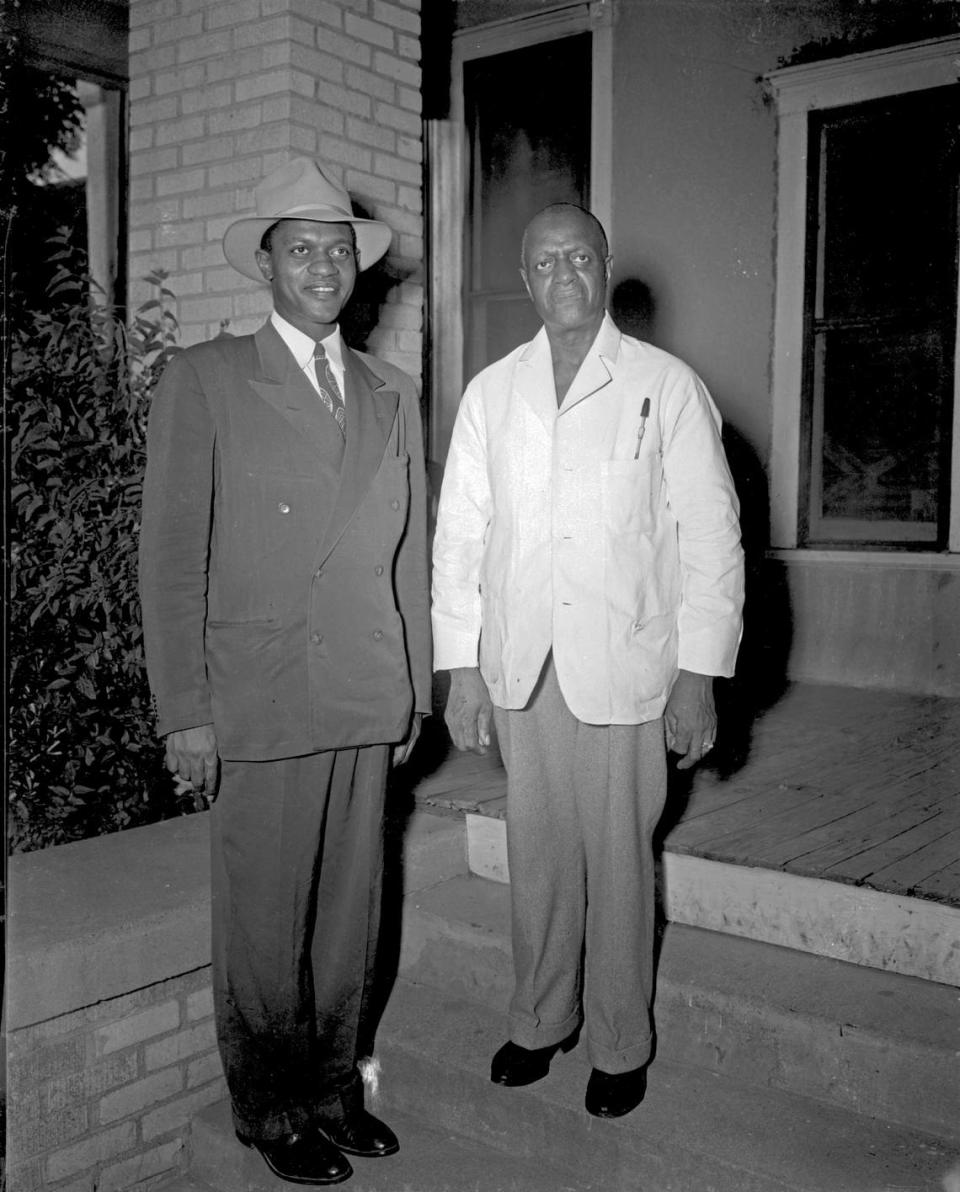 Dr. Riley A. Ransom Sr. (right) and his son Dr. Riley Ransom Jr. standing in front of the Ethel Ransom Memorial Hospital building in 1946.