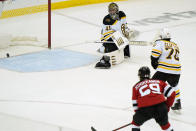 Boston Bruins goaltender Jaroslav Halak (41) watches a goal scored by New Jersey Devils center Yegor Sharangovich (17) cross the goal line during the third period of an NHL hockey game, Tuesday, May 4, 2021, in Newark, N.J. (AP Photo/Kathy Willens)