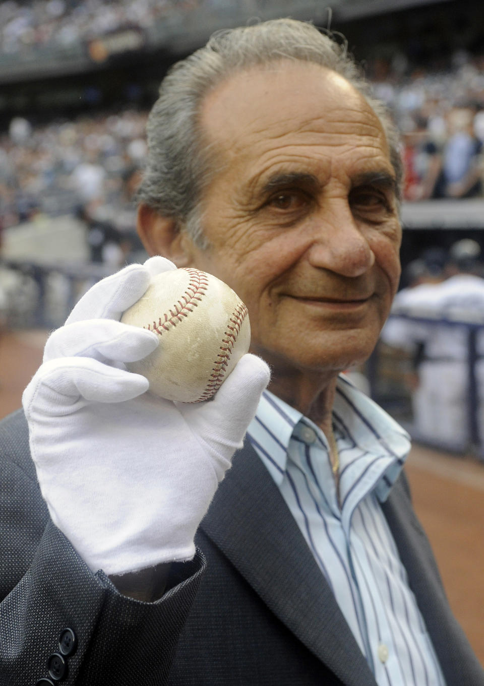 FILE - Sal Durante displays Roger Maris' 61st home run ball, on the 50th anniversary of Maris' 61 home runs in 1961, before the New York Yankees' baseball game against the Boston Red Sox on Saturday, Sept. 24, 2011, at Yankee Stadium in New York. If Aaron Judge passes Roger Maris, some lucky fan might become this generation's Sal Durante. (AP Photo/Bill Kostroun, File)