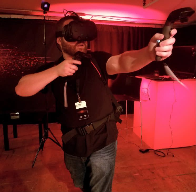 A man wearing the HP Omen X VR PC Pack