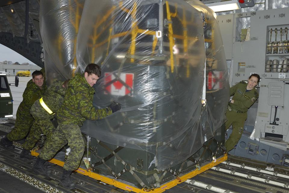 The advance party of the Disaster Assistance Response Team (DART) loads a C177 Globemaster bound for Hawaii at Canadian Forces Base Trenton