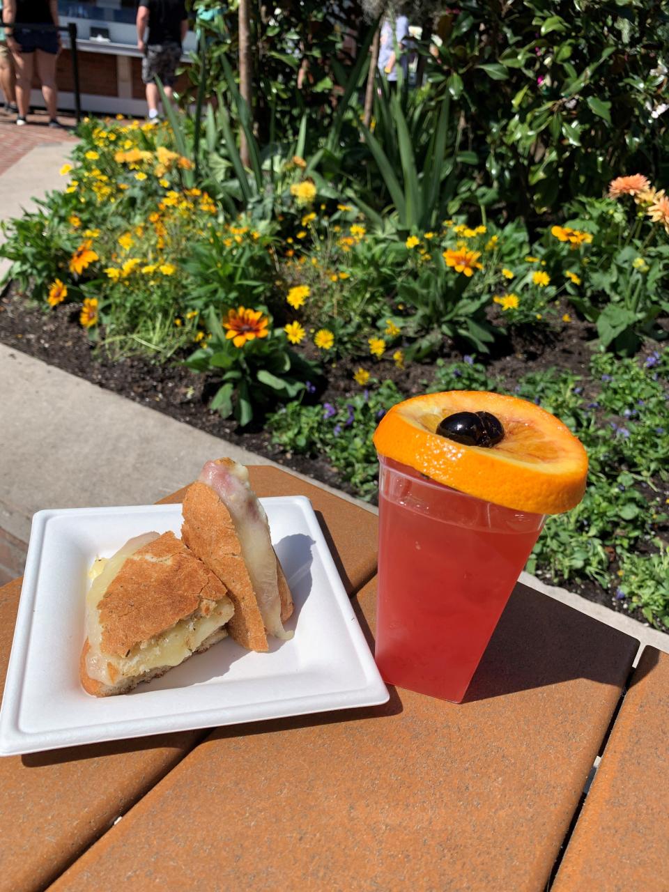 A Muffuletta Panini and a Bayou Cocktail from the Magnolia Terrace kitchen were favorite finds at the Epcot International Flower & Garden Festival.