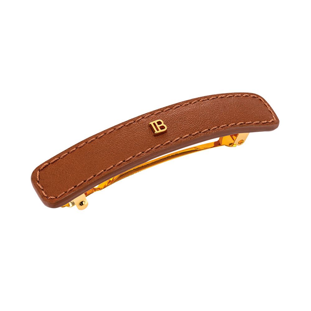 <p><a href="https://www.balmainhair.us/riviera-barrette-cognac-medium.html" rel="nofollow noopener" target="_blank" data-ylk="slk:Shop Now;elm:context_link;itc:0;sec:content-canvas" class="link rapid-noclick-resp">Shop Now</a></p><p>Riviera Barrette</p><p>$255.00</p><p>balmainhair.us</p><span class="copyright">Courtesy of Brand</span>