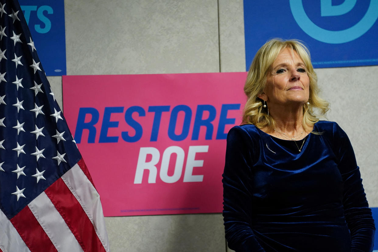 U.S. first lady Jill Biden listens as she is introduced to speak during a visit to DNC headquarters to thank the staff for their efforts during the midterm campaign season in Washington, U.S., October 19, 2022.  REUTERS/Kevin Lamarque