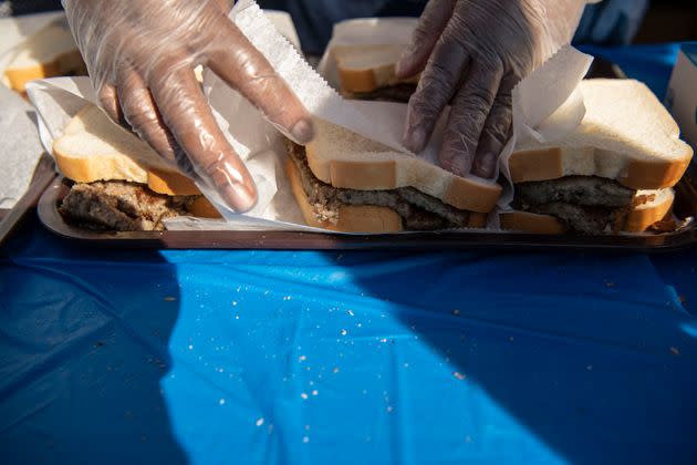 A vendor wraps scrapple sandwiches. (Photo: Damon Dahlen/HuffPost)