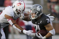 Washington State running back Max Borghi, right, carries the ball while pressured by Stanford linebacker Stephen Herron during the first half of an NCAA college football game Saturday, Oct. 16, 2021, in Pullman, Wash. (AP Photo/Young Kwak)