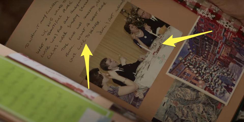 arrows pointing to things in jake's wife's memory book in falling for christmas