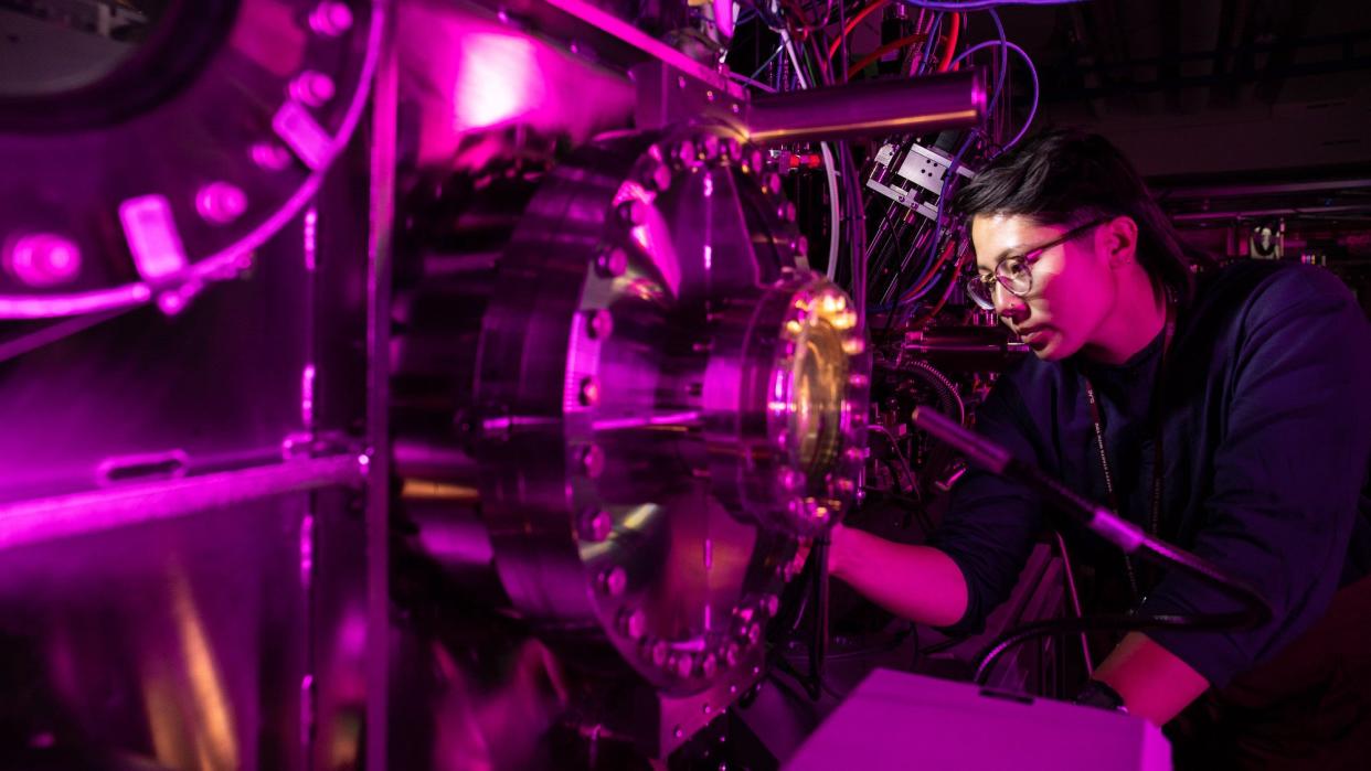 Scientist inspects portion of LCLS installation