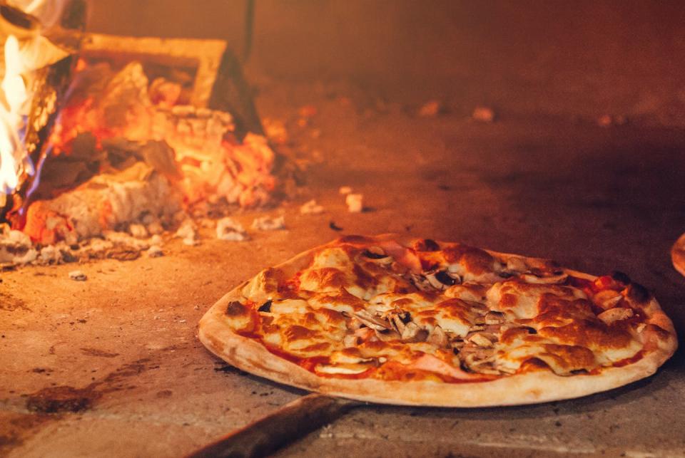 When pizza bakes in the oven, the ingredients become browned – and even tastier. <a href="https://www.shutterstock.com/image-photo/italian-pizza-cooked-woodfired-oven-655358575?src=daJEES1CkQ9anQUc5_GCzw-1-0" rel="nofollow noopener" target="_blank" data-ylk="slk:Andrewshots/Shutterstock.com;elm:context_link;itc:0;sec:content-canvas" class="link ">Andrewshots/Shutterstock.com</a>