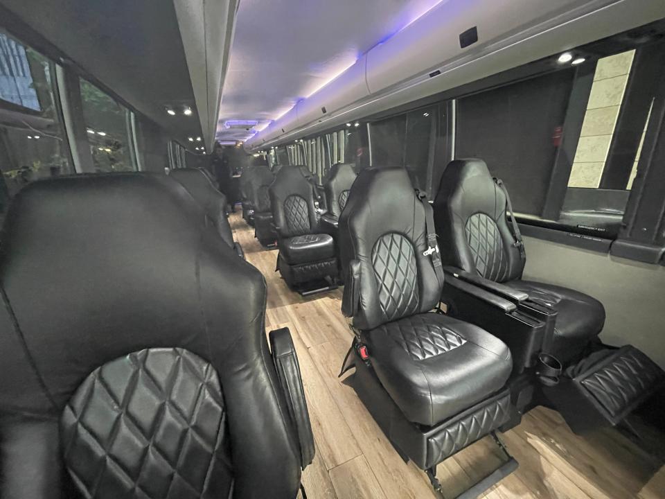 The interior of The Jet bus luxury bus, which is more spacious but has a similar seat configuration.