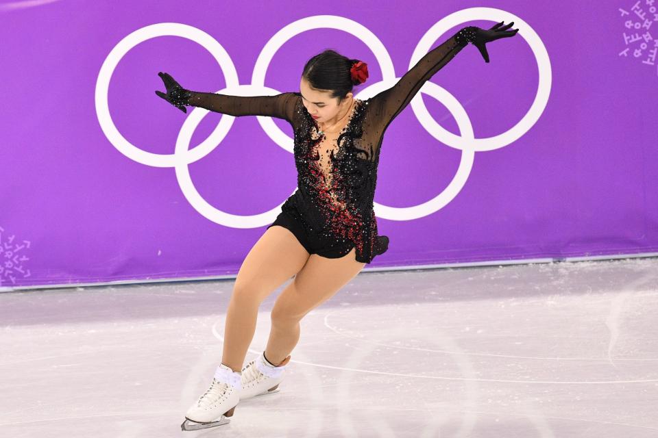 Chen, of the U.S., brought the drama in this lovely black costume&nbsp;with red accent sparkles, which she wore for her free skate. Bonus points for the flower in the hair.