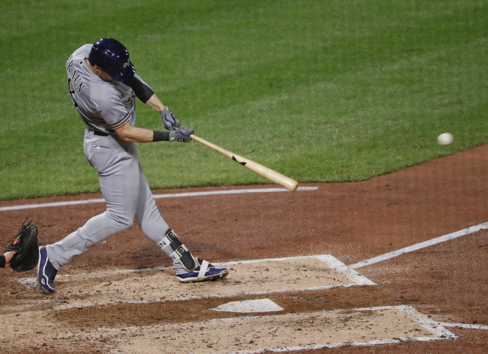 Milwaukee Brewers' Ryan Braun drives in Christian Yelich with a hit in the fourth inning of a baseball game against the Pittsburgh Pirates, Friday, Sept. 21, 2018, in Pittsburgh. (AP Photo/Keith Srakocic)