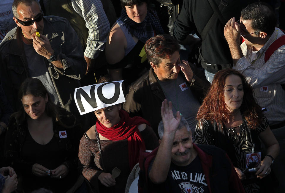 Protestors march against austerity measures announced by the Spanish government in Madrid, Spain, Saturday, Oct. 13, 2012. Several thousand people noisily banging pots and pans are marching down Madrid's main north-to-south boulevard protesting the government's austerity measures. With unemployment nearing 25 percent, Spain has introduced biting austerity measure as well as financial and labor reforms in a desperate bid to lower its deficit and assuage investors' misgivings. (AP Photo / Andres Kudacki)