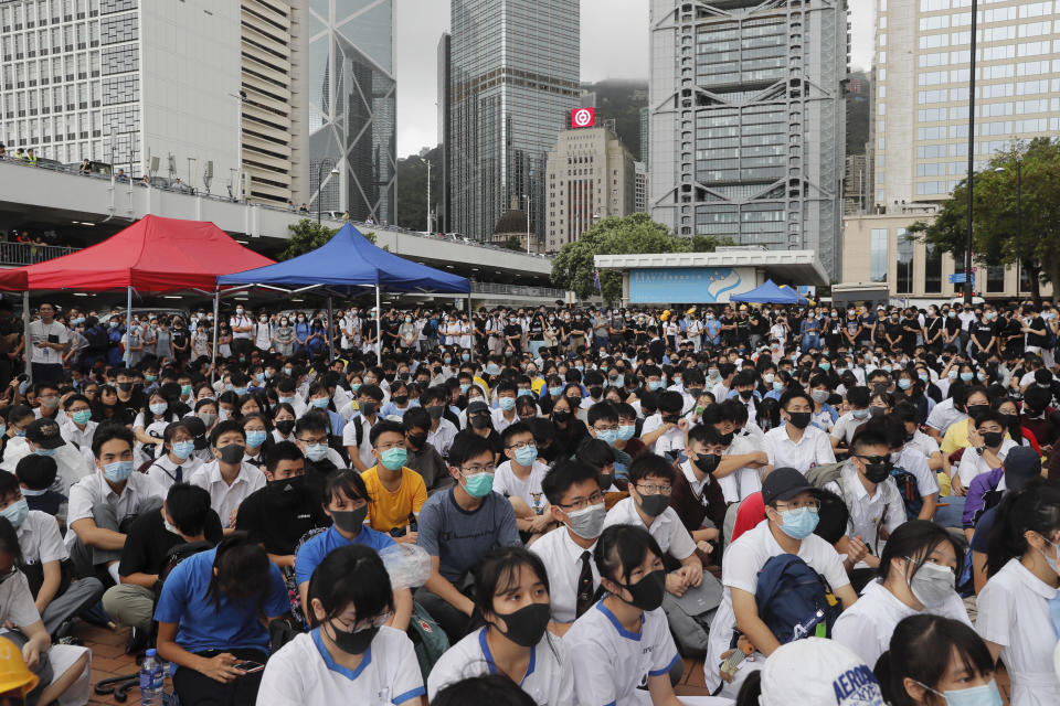 Secondary students sit on the ground during a protest at Admiralty in Hong Kong, on Monday, Sept. 2, 2019. Hong Kong has been the scene of tense anti-government protests for nearly three months. The demonstrations began in response to a proposed extradition law and have expanded to include other grievances and demands for democracy in the semiautonomous Chinese territory. (AP Photo/Kin Cheung)