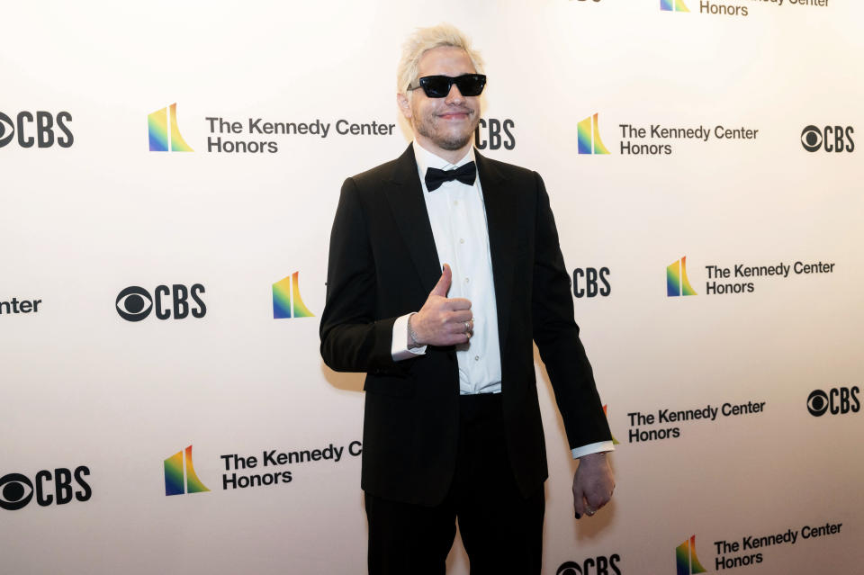 Comedian Pete Davidson poses on the red carpet at the 44th Kennedy Center Honors gala on Sunday, Dec. 5, 2021, in Washington.  (AP Photo/Kevin Wolf)