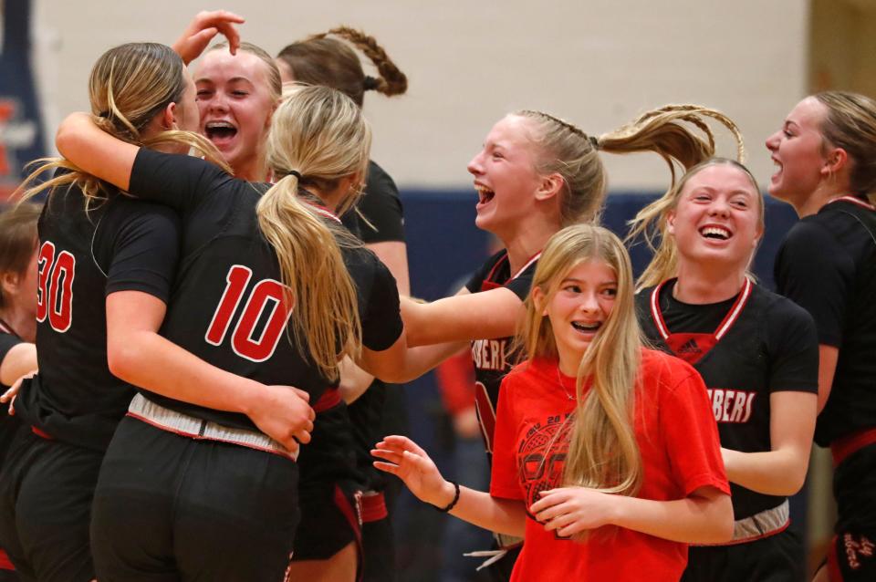 Rensselaer Central Bombers celebrate after the IU Health Hoops Classic Girl’s Basketball Championship against the West Lafayette Red Devils, Saturday, Nov. 18, 2023, at Harrison High School in West Lafayette, Ind. Rensselaer Central Bombers won 58-53.