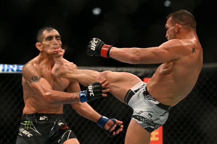 Tony Ferguson looks like a different person when he's front kicked by Michael Chandler.