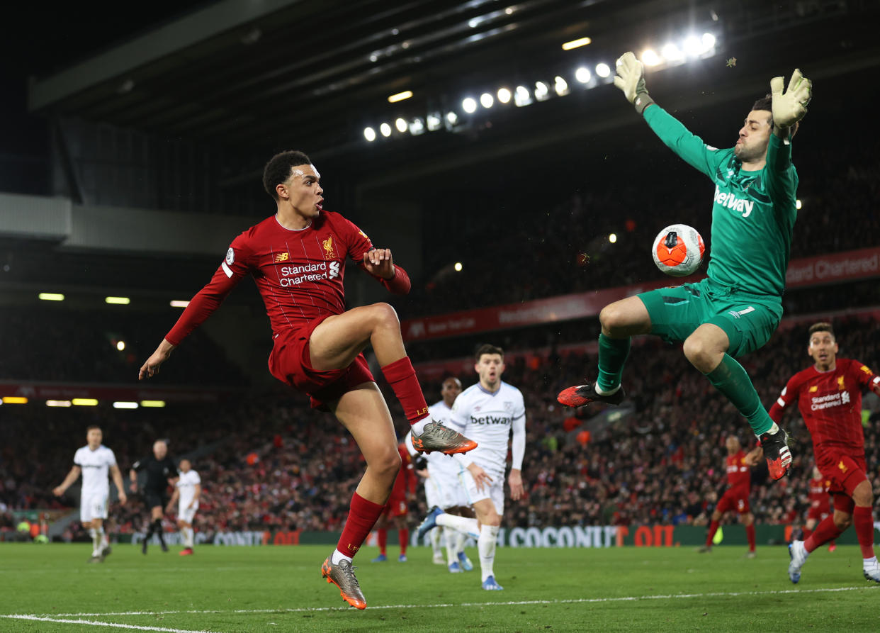 Trent Alexander-Arnold (left) helped set up two of Liverpool's goals in a 3-2 win over West Ham on Monday. (Photo by Clive Brunskill/Getty Images)