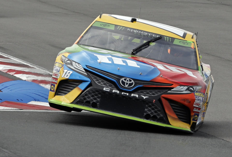 Kyle Busch takes his car through the backstretch chicane during practice for Sunday's NASCAR Cup Series auto race at Charlotte Motor Speedway in Concord, N.C., Saturday, Sept. 29, 2018. (AP Photo/Chuck Burton)